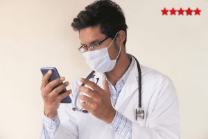 vecteezy_young-doctor-talking-to-smart-phone-fs8